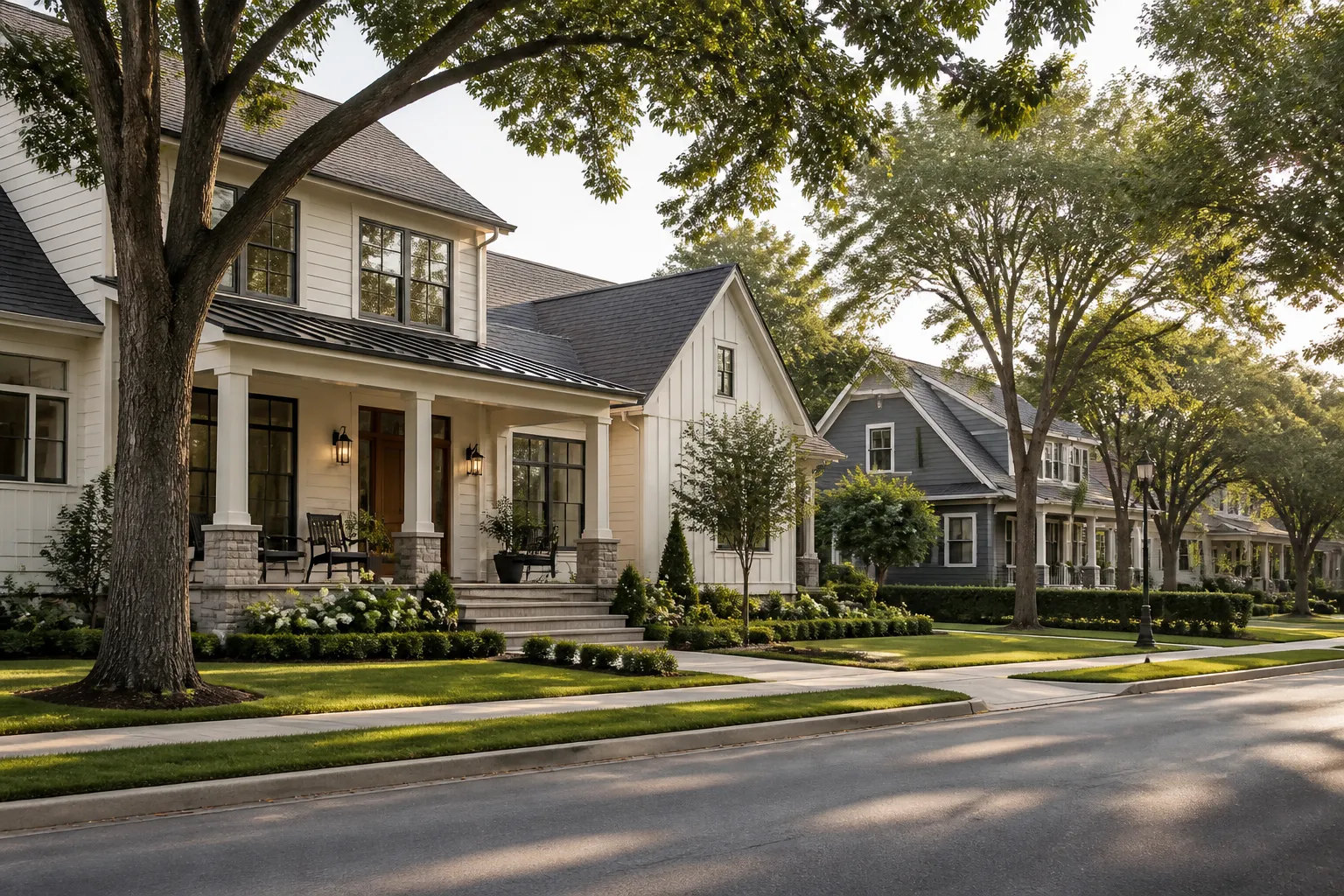 Refined homes and mature trees along a calm neighborhood street.